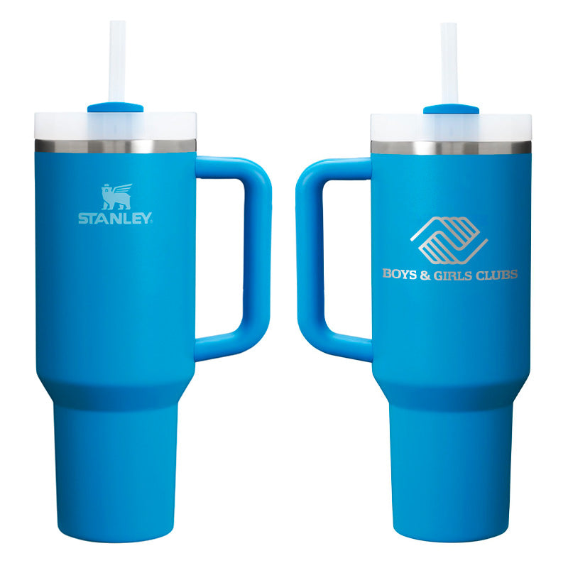 Two 40 oz azure blue Stanley tumblers with handles and straws, featuring Stanley logo on one side and Boys & Girls Clubs logo on the other.