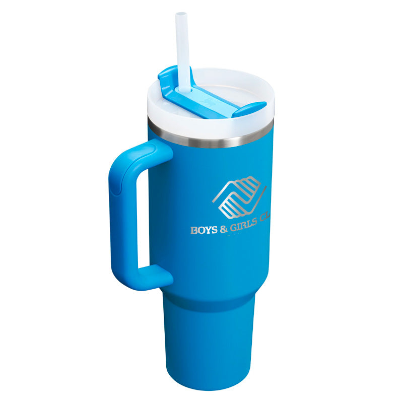 Top angled view of a 40 oz azure blue Stanley tumbler with handle, straw, and Boys & Girls Clubs logo engraved on the side.