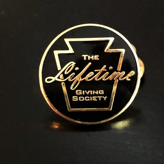 The Lifetime Giving Society Black and Gold Lapel Pin